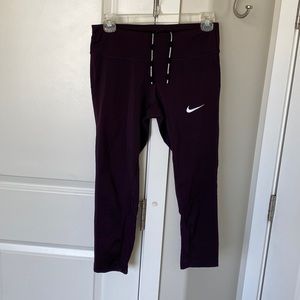 Nike capri length dri-fit leggings. Plum color
